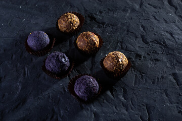 Colored round candies on a dark background