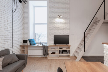 Apartment with stairs to mezzanine - obrazy, fototapety, plakaty