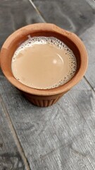 A kulhar or kulhad cup (traditional handle-less clay cup) from North India filled with hot Indian tea