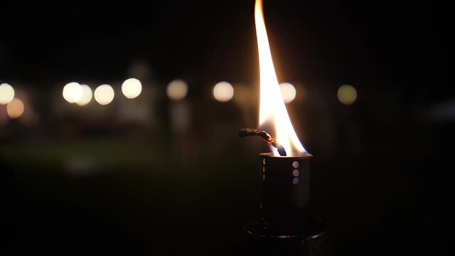 fire torch flame outdoor garden at night slow motion