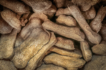 Background of pile of dog bone treats filling frame - selective focus
