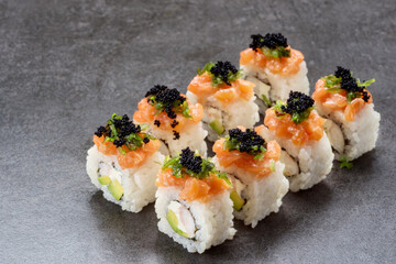 Sushi with shrimp, salmon, rice, Philadelphia cheese, and tobiko