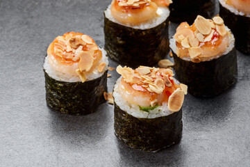 Sushi roll with rice, salmon, tuna fish, nori