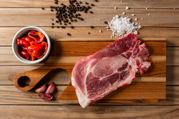 raw meat steak on a wooden board