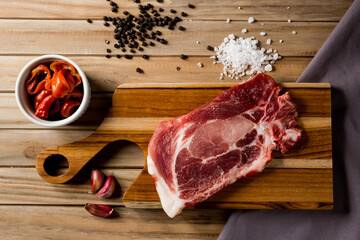 raw meat steak on a wooden board