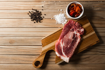 raw meat steak on a wooden board