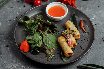Spring rolls with shrimp with sweet chili sauce. Asian cuisine