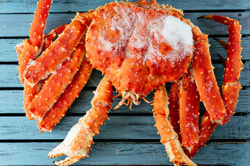 large frozen crab on a Board