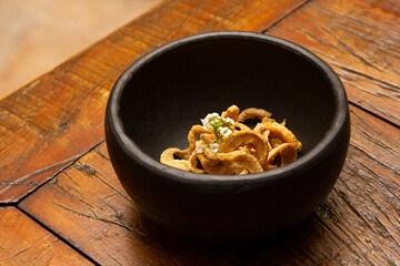 Delicious appetizer of fried pork rinds.