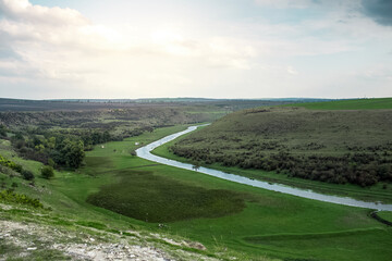 Fototapeta na wymiar Natural background. View of Reut (Raut) river. Landscape of nature of Moldova in sunny day.