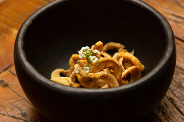 Delicious appetizer of fried pork rinds.