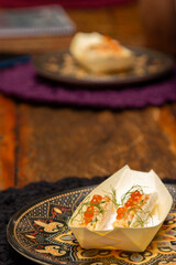 Salmon tartare with salmon roe in the tapioca boat