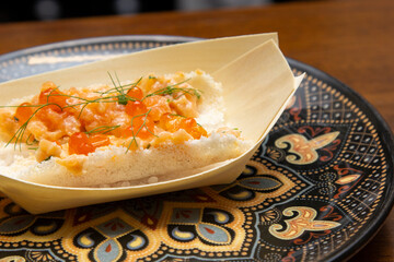 Salmon tartare with salmon roe in the tapioca boat