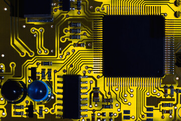 Macro close-up shot of microchip, processor on printed circuit board / motherboard of industrial...