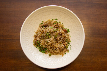 Duck rice with peas and spices