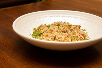 Duck rice with peas and spices