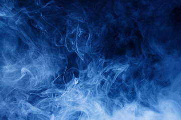 Abstract blue smoke moves on black background. Swirling smoke.