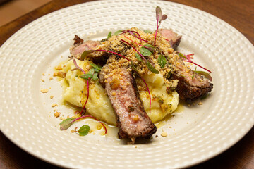 Ancho with Aligot, Chimichurri and fried pork flour.