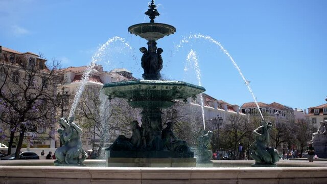 fountain in Rossio square dowtown Lisbon, Portugal slow motion