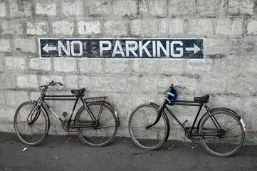 two bicycles at the wall