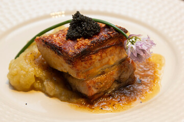 Pork belly with green apple puree and caviar