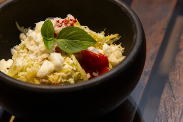 Spaghetti from pupunha with pesto and goat cheese.