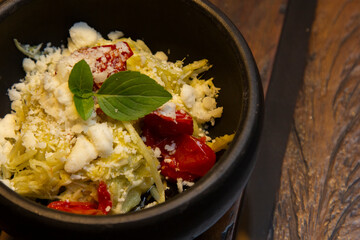 Spaghetti from pupunha with pesto and goat cheese.