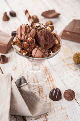 Chocolate ice-cream on the white wooden table