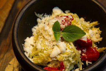 Spaghetti from pupunha with pesto and goat cheese.