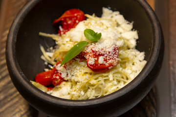 Spaghetti from pupunha with pesto and goat cheese.