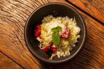 Spaghetti from pupunha with pesto and goat cheese.