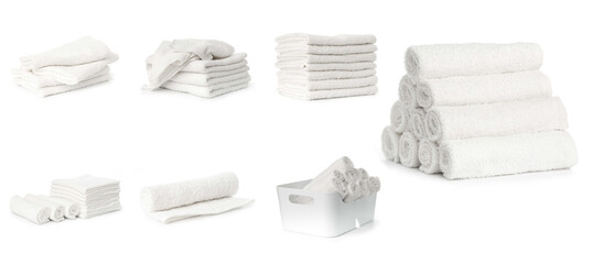 set of white spa towels stacked and in basket isolated on white background