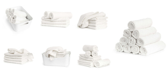 set of white spa towels stacked and in basket isolated on white background