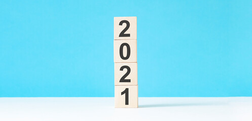2021 new year wooden cubes on blue table background with copy space for text. Business Goals, Mission, Resolution, New Year New You concept