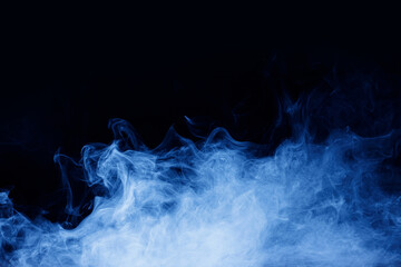 Abstract blue smoke moves on black background. Swirling smoke.