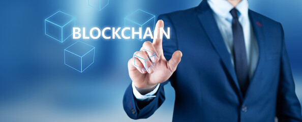 Obraz premium man touching a blockchain on a screen