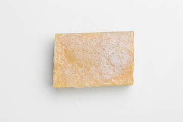 Soap bar and foam on white background, top view. Mockup for design