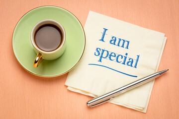 I am special - positive affirmation, handwriting on a napkin with a cup of coffee, self confidence and personal development concept