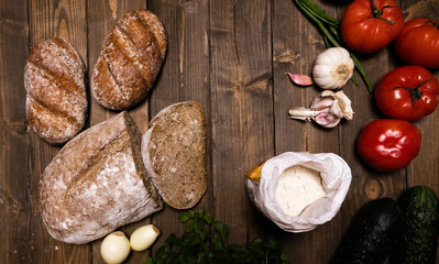 vegetables and bread  on a wooden board