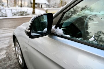 Car wheel on the snow in winter.