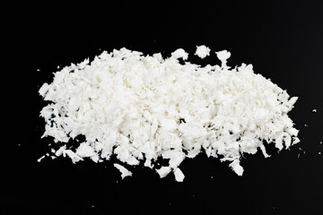 white artificial synthetic snow on black background