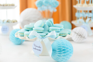 Tasty french macarons on a beautiful sweet table at the family party