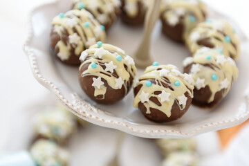 Tasty pralines in chocolate glaze on a candy bar at the party