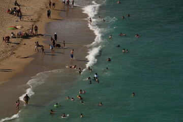 crowd of people on the beach taken from the air