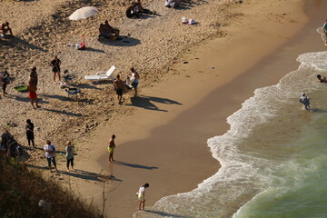 crowd of people on the beach taken from the air