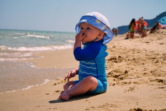 Beach vacation. Kid on the sandy beach. Summer at sea. Traveling with children. High quality photo