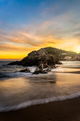 Fototapeta na wymiar Mesmerizing view of wonderful sunset in La Fosca Palamos in Costa Brava