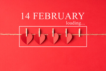 Valentines day is coming concept. Flat lay close up view photo of little red bright color hearts hanging on rope with inscription isolated vivid backdrop