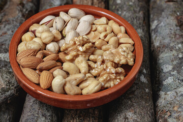 dried fruit in light brown dish on the wood