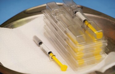 Syringes on a blue background in a hospital